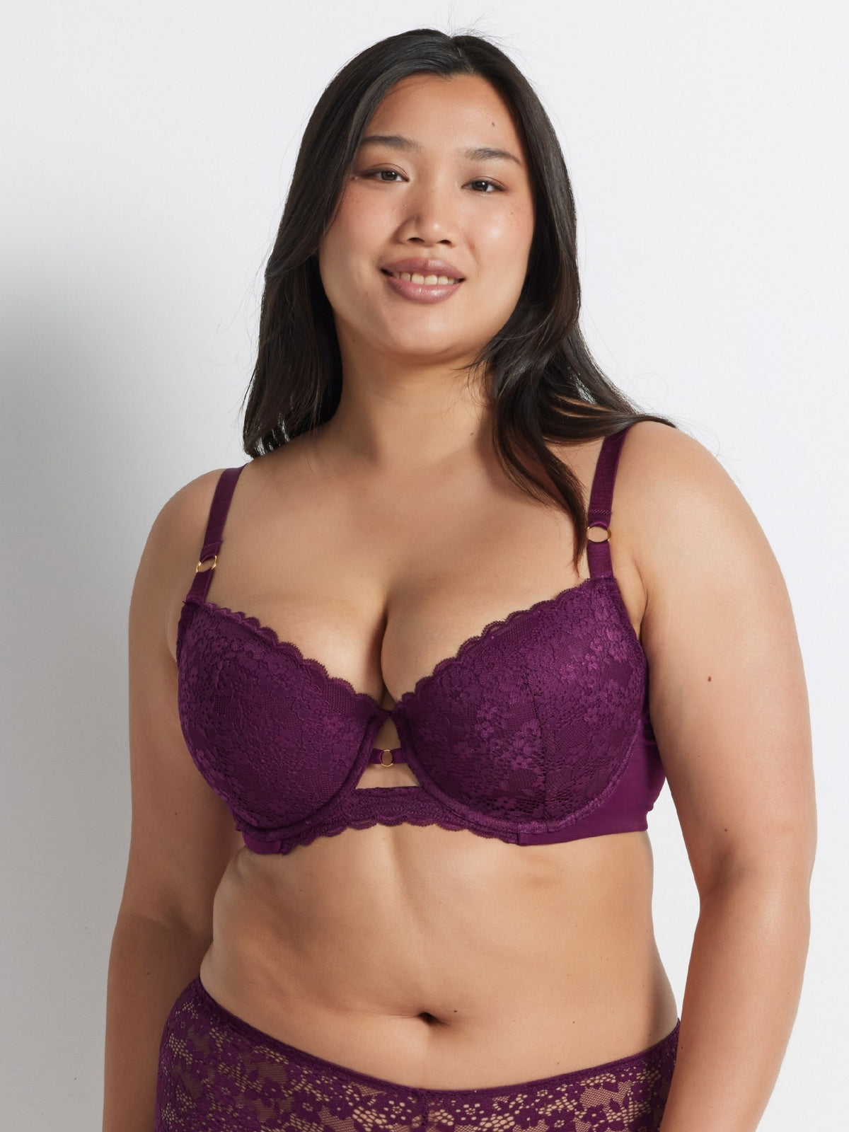 Chloe is wearing the Be Free Lace Balconette Bra in Burgundy with matching briefs by Kayser Lingerie