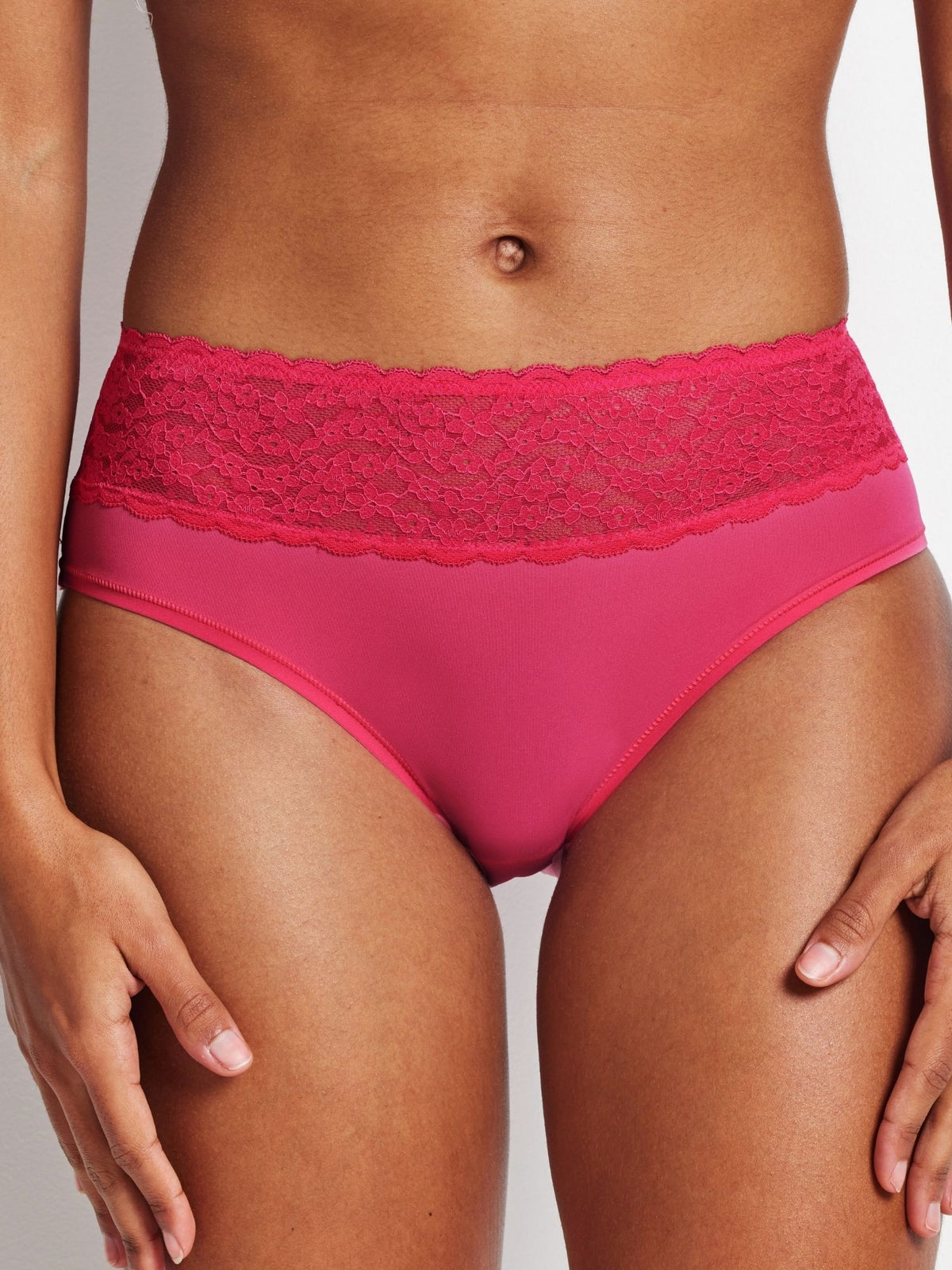Close-up front view of pink Fruit Dove Glowlights Hi-Rise Brief lace waistband.