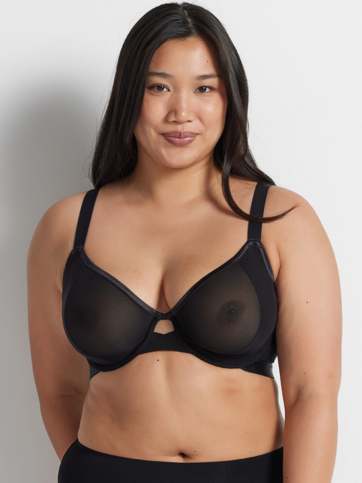 Chloe is wearing the Hold Up Neo Mesh Underwire Bra in black by Kayser Lingerie