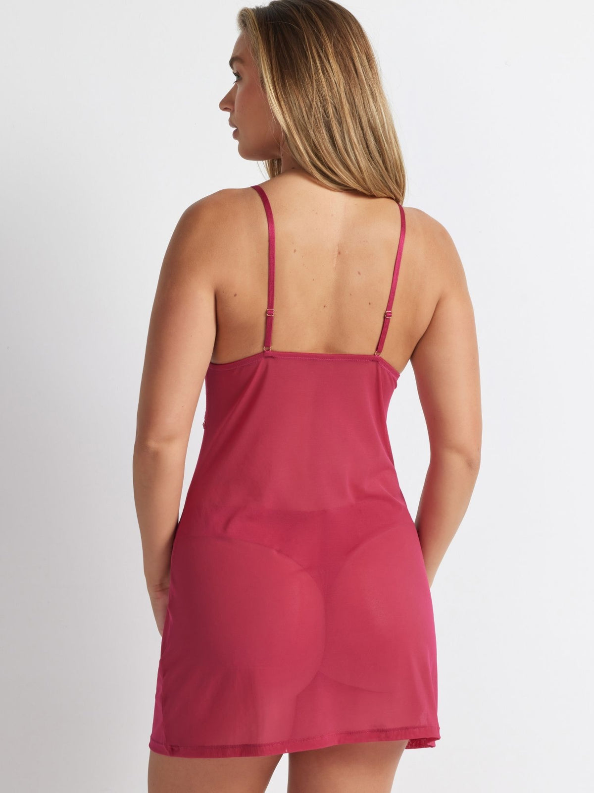 Rust After Dark Chemise worn from behind, showing the sheer mesh body and adjustable straps.