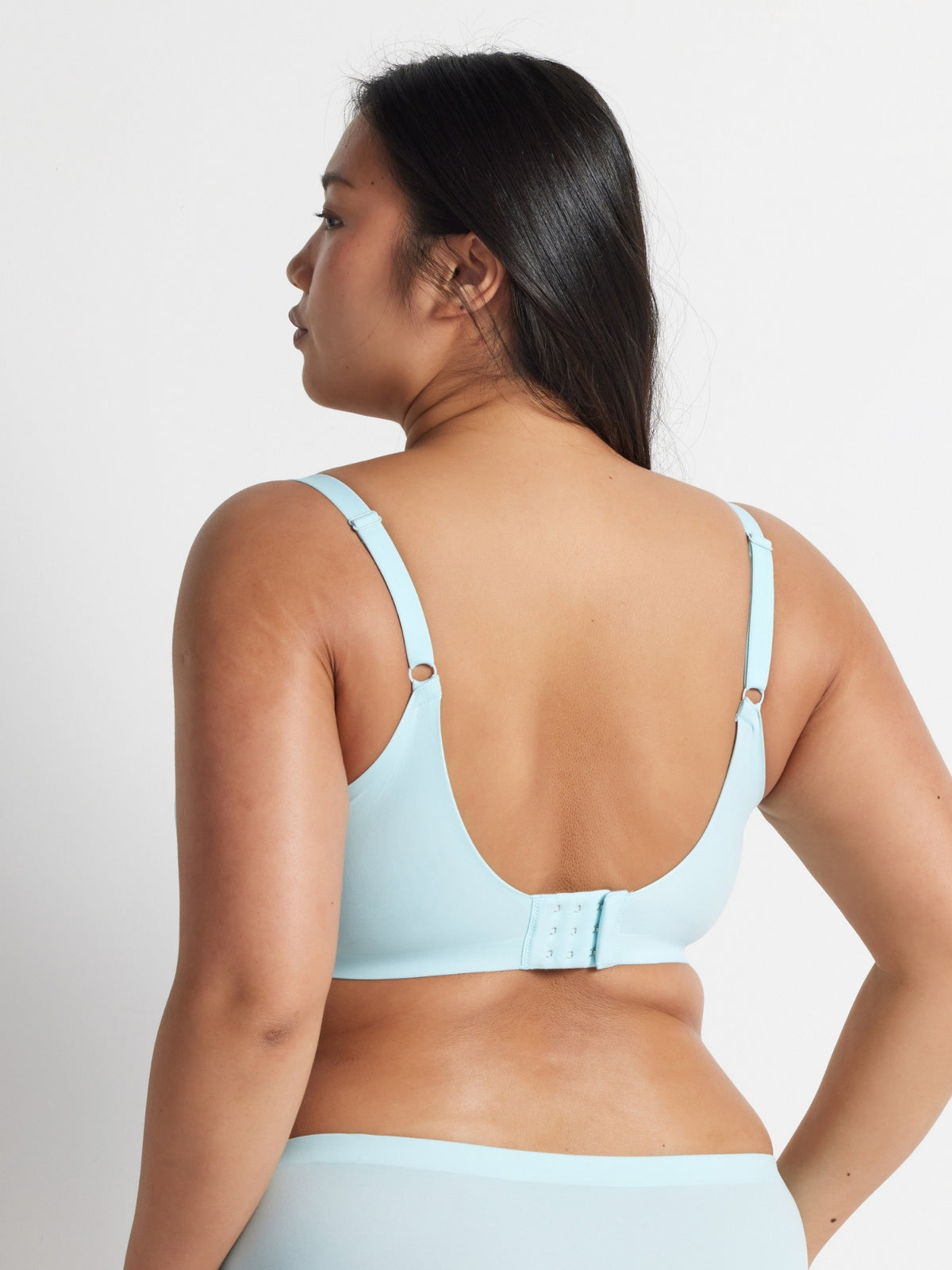 Back view of the aqua blue t-shirt bra showing the adjustable straps and hook and eye closure.