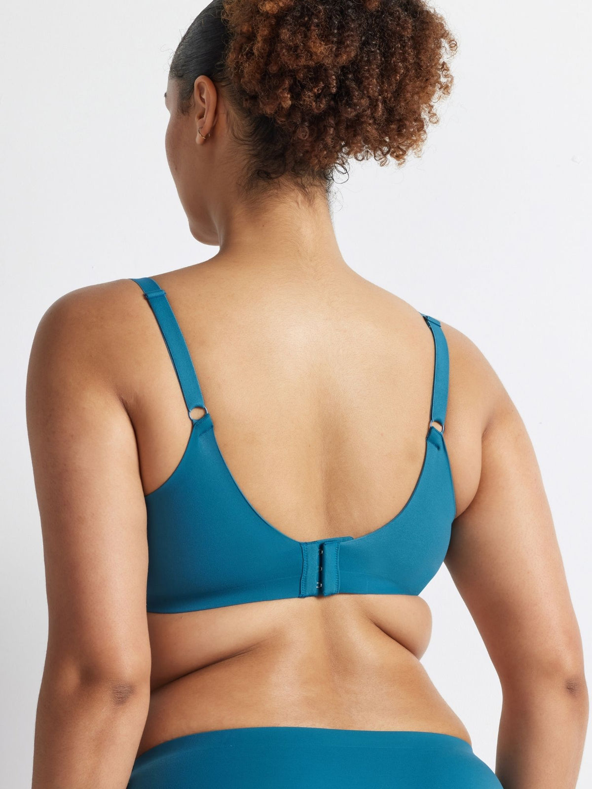 Back view of the Kayser Alive T-Shirt Bra in Blue Coral showing adjustable straps and a secure hook-and-eye closure.