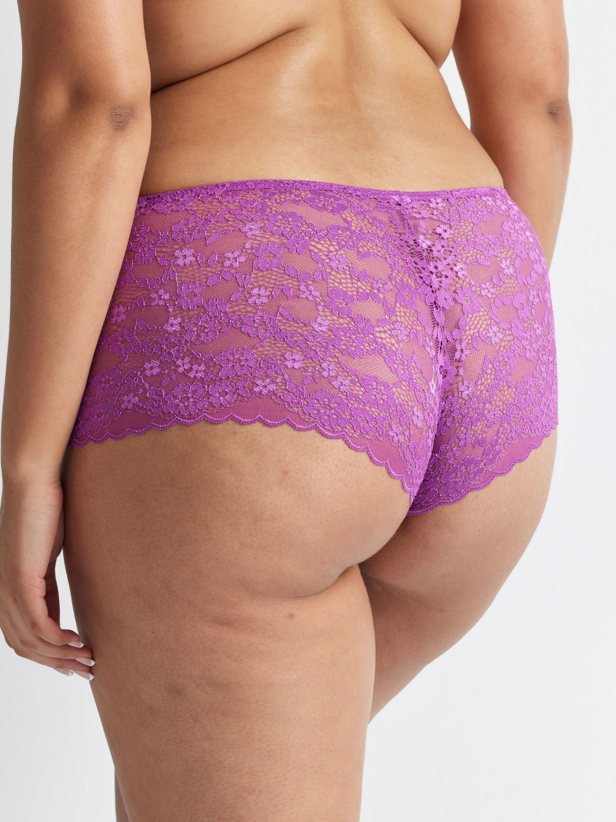 Back view of the Be Free Lace Short in Sweet Pea showcasing full lace coverage and a smooth, flattering fit.