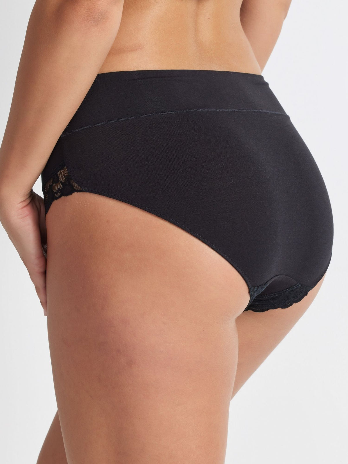 Back view of the Comfort Band Lace Trim Mid Rise in Black showing full coverage and a comfortable, flattering fit.
