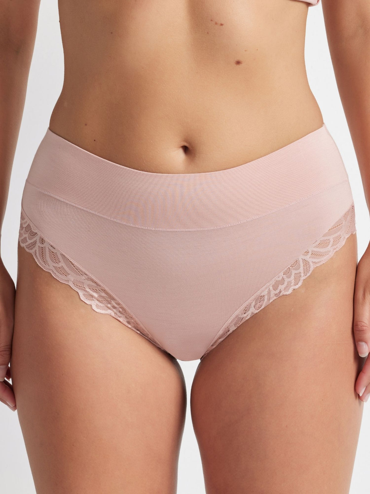 Close-up detail of the Comfort Band Lace Trim Mid Rise in Blush lace trim and soft, flexible waistband.