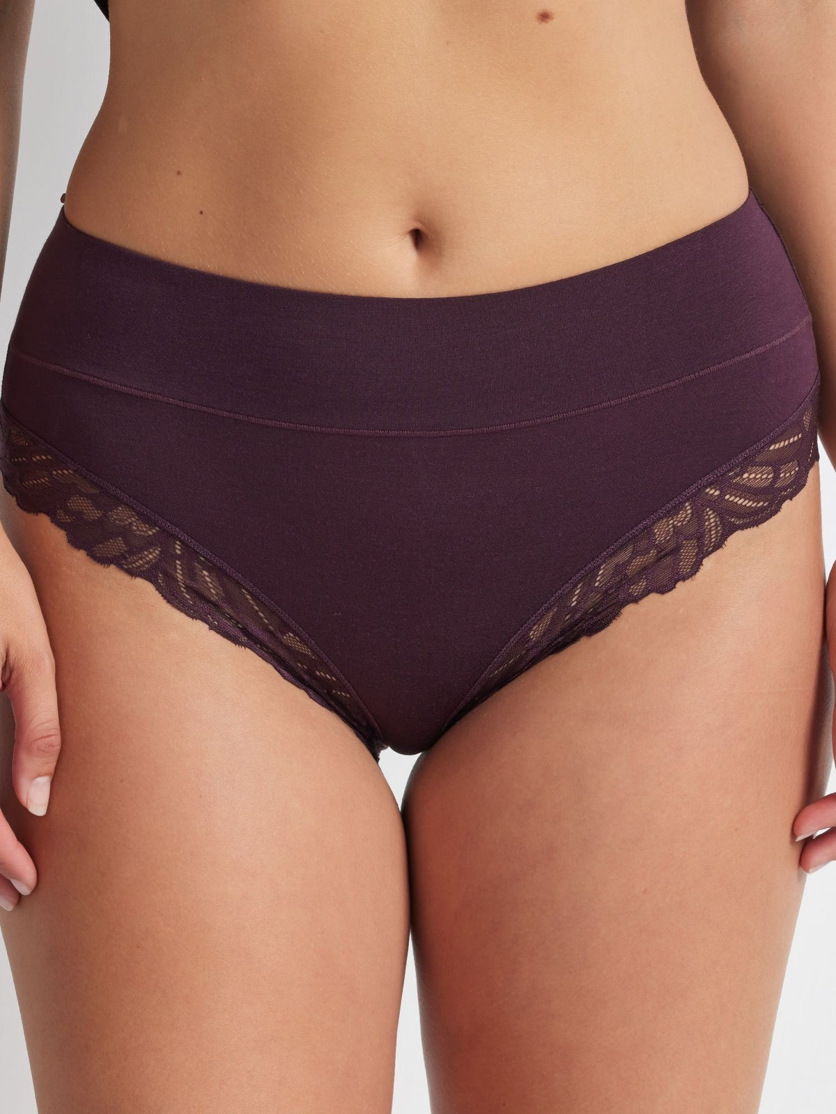 Close-up detail of the Comfort Band Lace Trim Mid Rise in Plum focusing on the lace edge and stretch fabric.