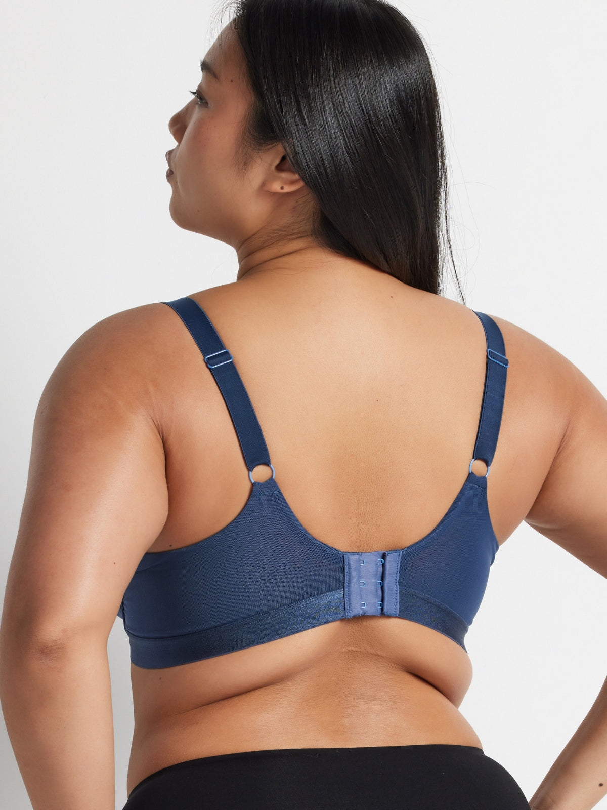 Back view of the indigo Hold Up Neo Mesh Underwire Bra showing the wide wings and adjustable straps.